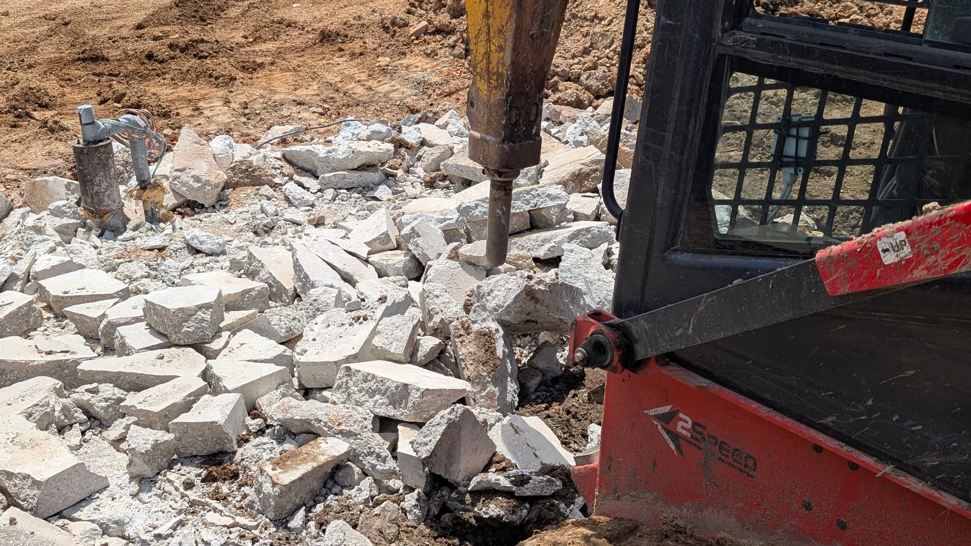 Breaking Out Old Concrete Footers to Prep for a New Pad