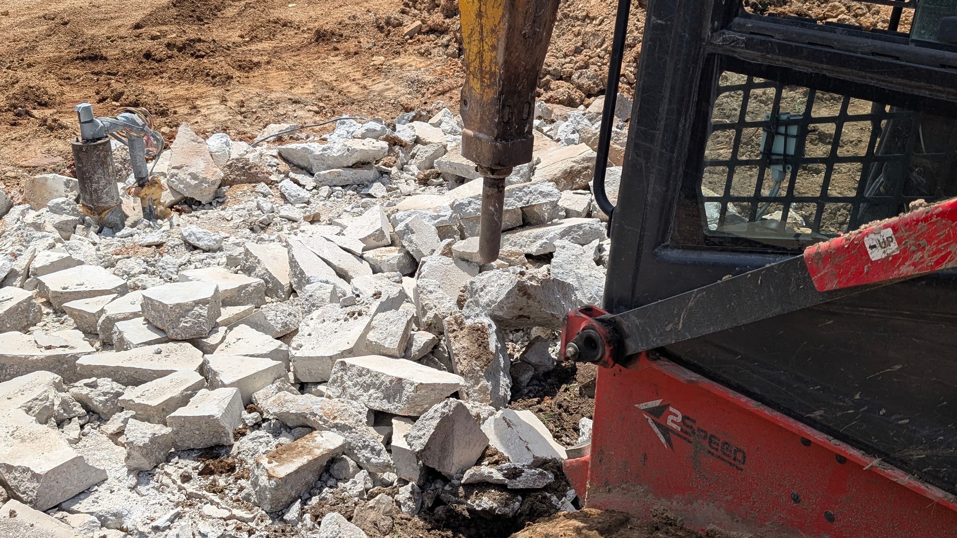 Project Breaking Out Old Concrete Footers to Prep for a New Pad image