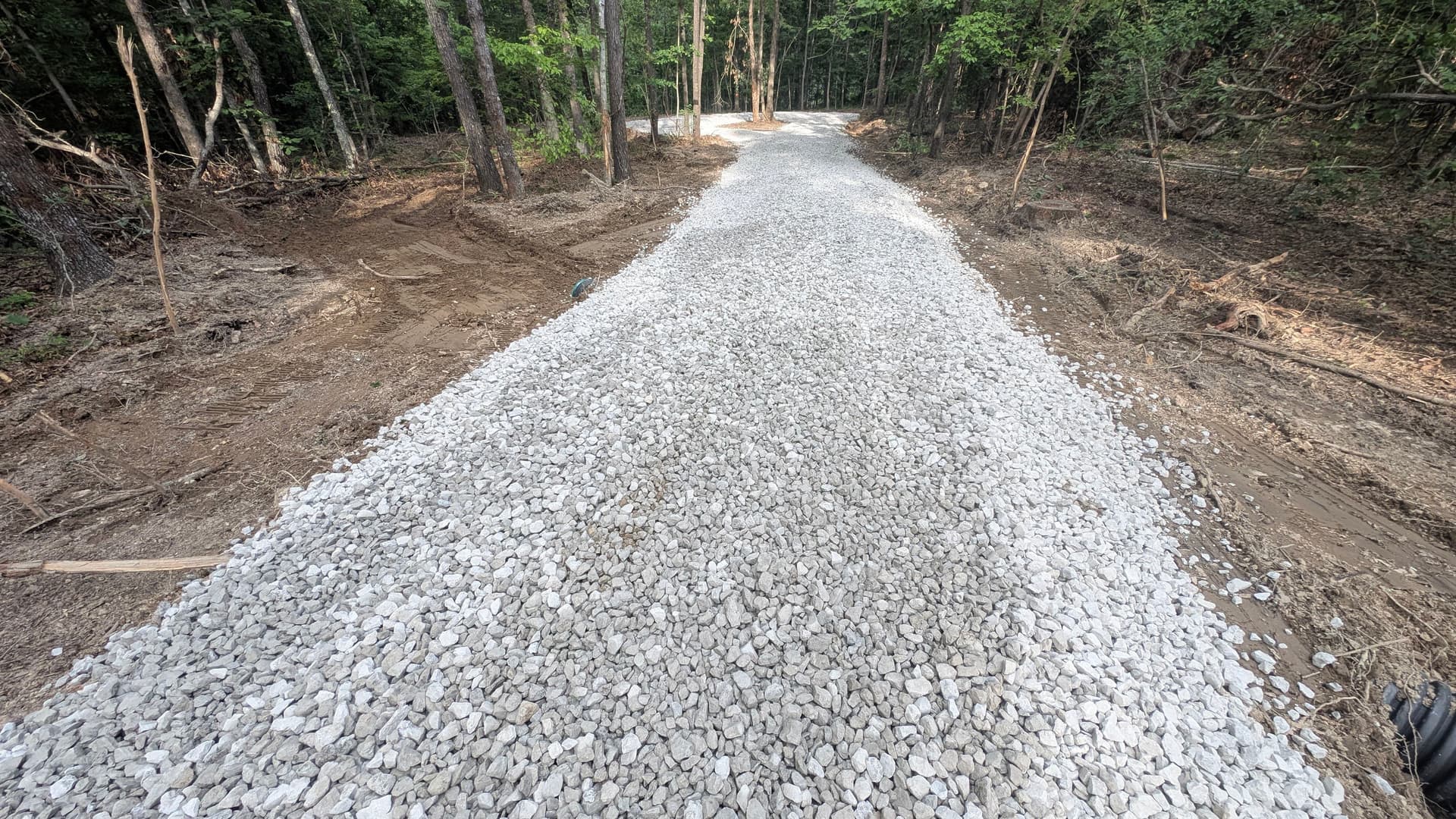 Gallery photos for Gravel Driveway Cut Through the Woods for Clean Property Access: Image #2