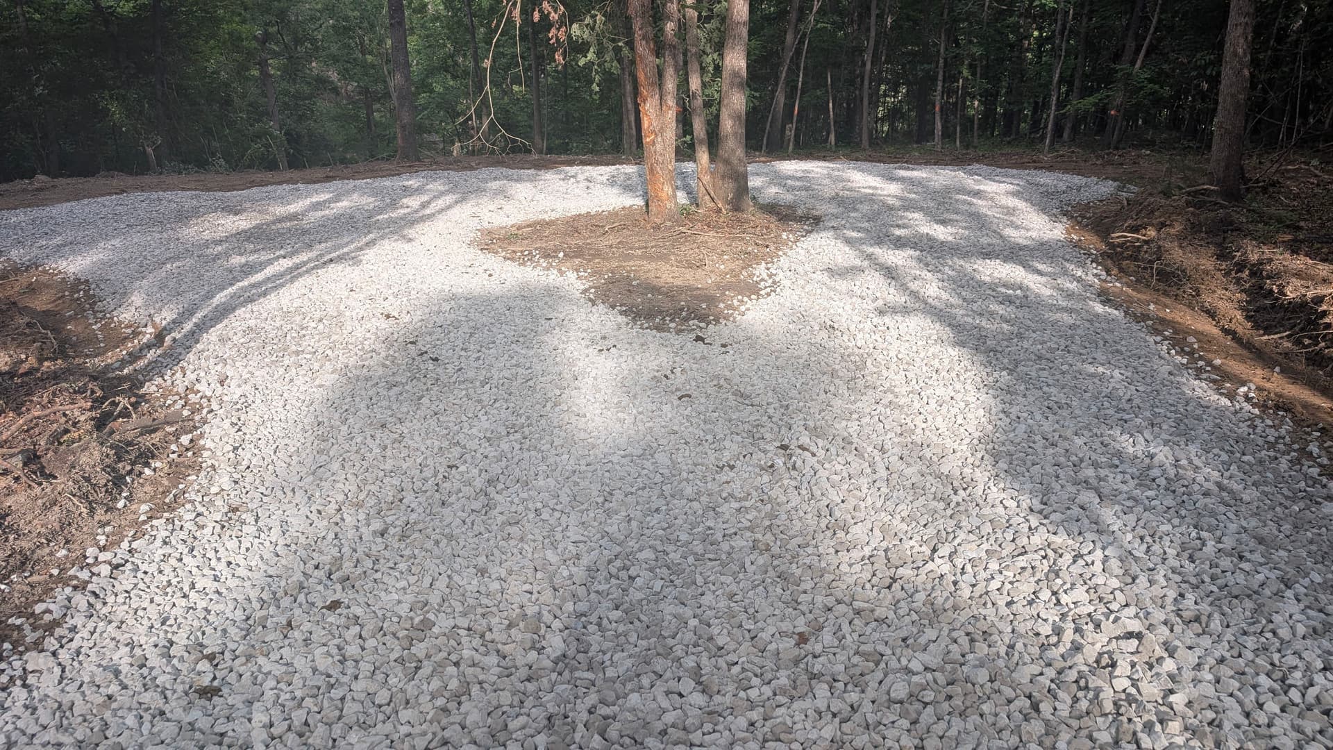 Gravel Driveway Cut Through the Woods for Clean Property Access image